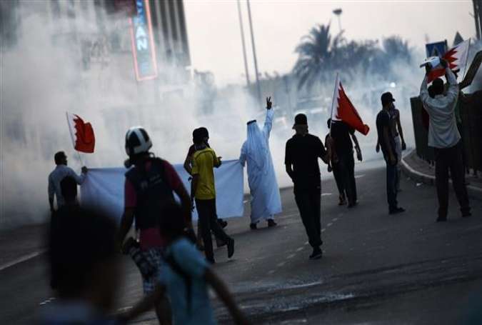 Bahraini protesters clash with riot police following a demonstration against the continued imprisonment of top Shia cleric Sheikh Ali Salman, and jailed former lawmaker Sheikh Hassan Isa, in Sitra, south of the capital, Manama, August 28, 2015.