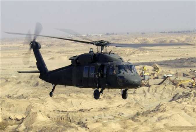 A UH-60L Black Hawk flies a low-level mission over Iraq in January 2004.