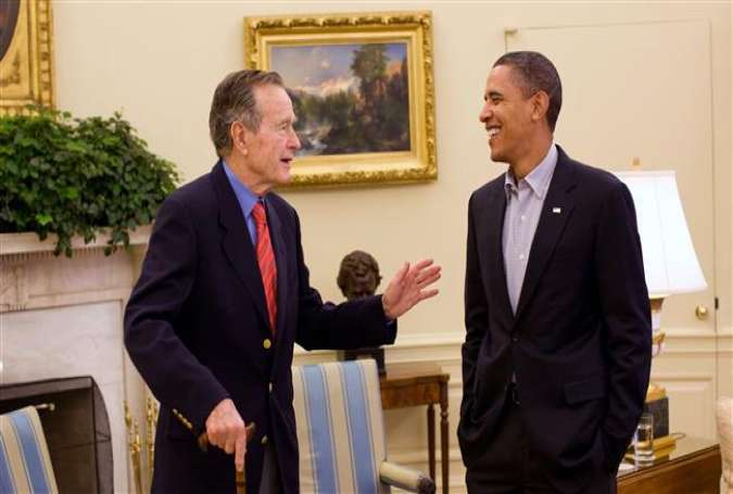 George H.W. Bush (left) meets President Barack Obama in the Oval Office of the White House on January 30, 2010.