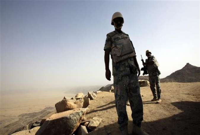 Saudi soldiers are seen standing at the border with Yemen in the southwestern Najran province, April 21, 2015.