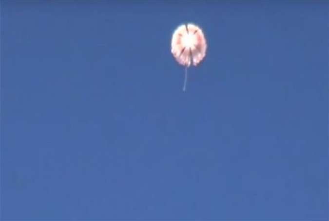 A frame grab shows one of the two Russian pilots parachuting from a Sukhoi aircraft that was shot down by the Turkish Air Force, November 24, 2015.