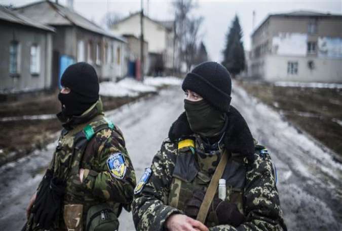 Ukrainian Army soldiers patrol the empty streets of Debaltseve, in the Donetsk region, on February 3, 2015.