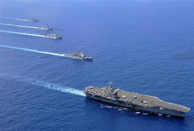 The aircraft carrier USS Nimitz (CVN 68), the guided-missile cruiser USS Chosin (CG 65), the guided-missile destroyers USS Sampson (DDG 102) and USS Pinkney (DDG 91), and the guided-missile frigate USS Rentz (FFG 46) operate in formation in the South China Sea.