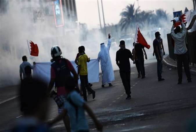 Bahraini protesters clash with riot police following a demonstration on the eastern island of Sitra on August 28, 2015.