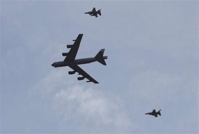 A US strategic bomber B-52 and two Jordanian F-16 aircraft participate in military exercises in a field south of Amman, Jordan, May 18, 2015.
