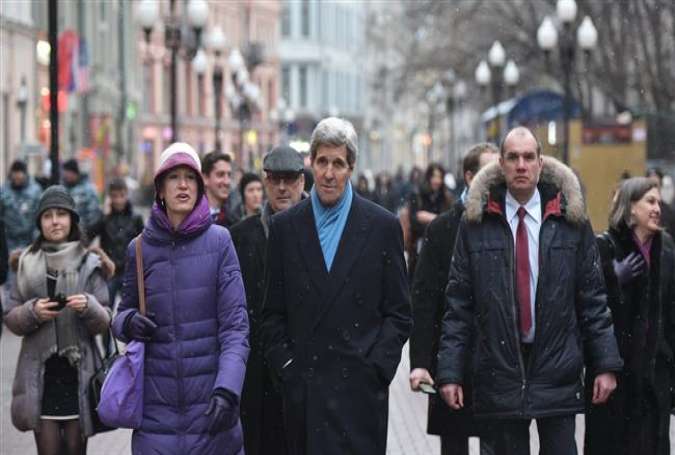 US Secretary of State John Kerry (C) walks with Celeste Wallander (L) of the National Security Council in Moscow on December 15, 2015.