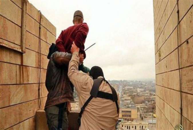Daesh Takfiris executie a man by throwing him from a tall building in Iraq.