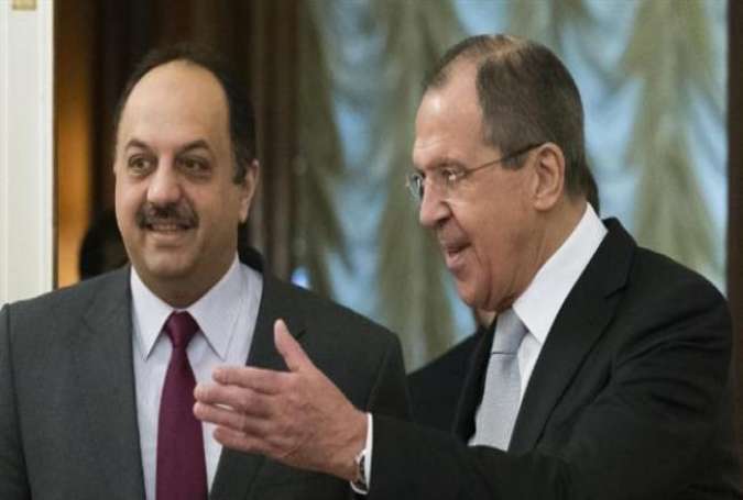 Russian Foreign Minister Sergei Lavrov (R) greets Qatari Foreign Minister Khalid bin Mohammad al-Attiyah as they enter a hall for their talks in Moscow on December 25, 2015.
