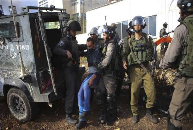 Israeli forces nab a Palestinian during clashes outside the West Bank city of Ramallah, October 30, 2015.