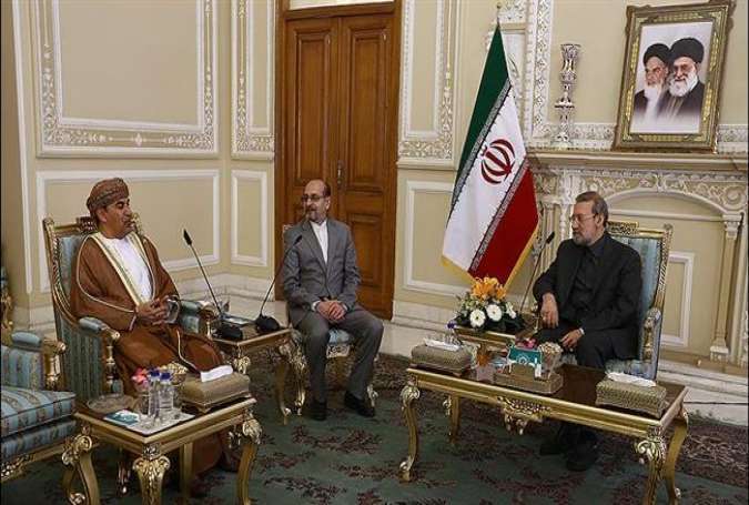 Iran’s Parliament Speaker Ali Larijani (R) and Oman’s Ambassador to Tehran Saud bin Ahmad al-Barwani meet on January 4, 2016.