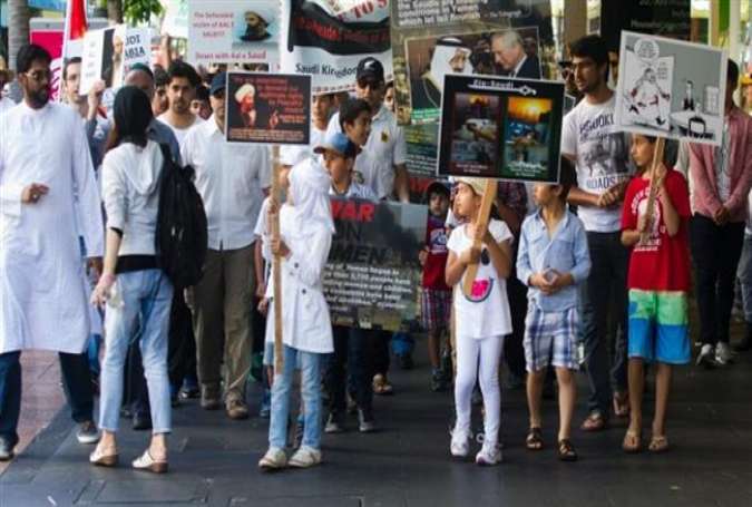 People hold a rally in Auckland, New Zealand, on January 10, 2016, protesting against the recent execution of prominent Shia cleric, Sheikh Nimr al-Nimr by Saudi government.