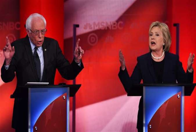 US Democratic presidential candidates Hillary Clinton (R) and Bernie Sanders participate in the MSNBC Democratic Candidates Debate at the University of New Hampshire in Durham, February 4, 2016.