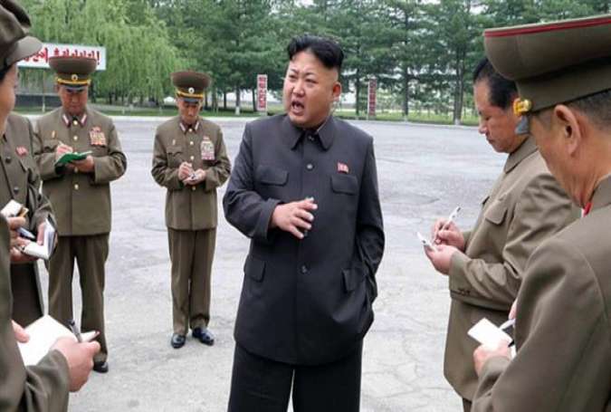 North Korean leader Kim Jong-Un (c.) gives field guidance during his visit to the Chonma Electrical Machine Plant in this undated photo released by North Korea