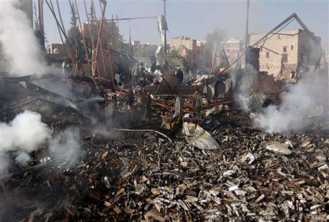 Yemenis inspect the damage at a sewing workshop that was hit by a Saudi airstrike in the capital, Sana