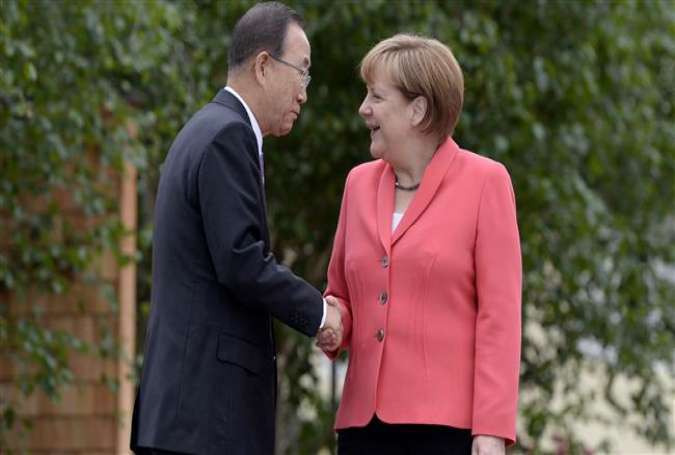 United Nations Secretary-General Ban Ki-moon is greeted by Germany