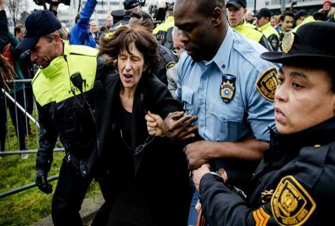 Florence Hartmann, former spokeswoman of the International Criminal Tribunal for Former Yugoslavia (ICTY) in The Hague, on March 24, 2016, is arrested before the reading of the verdict Bosnian Serb wartime leader Radovan Karadzic.