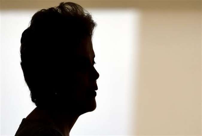 The silhouette of Brazilian President Dilma Rousseff is seen during a meeting with jurists and lawyers at the Planalto Palace in Brasilia in March 22, 2016.