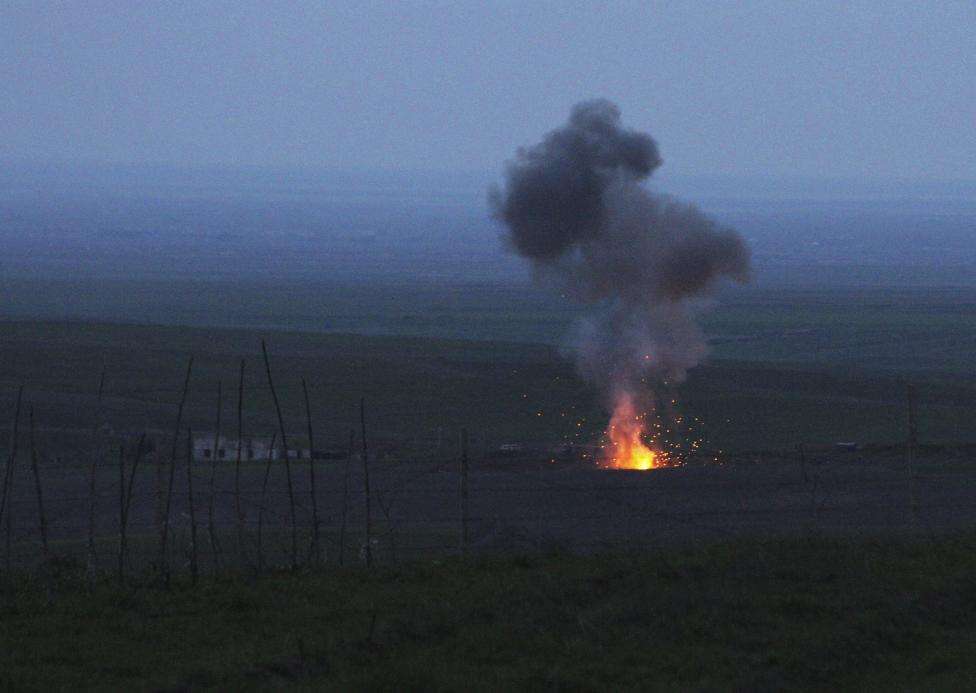 Smoke from fire rises above the ground in Martakert province, after an unmanned military air vehicle was shot down by the self-defense army of Nagorno-Karabakh according to Armenian media, during clashes over the breakaway Nagorno-Karabakh region, April 