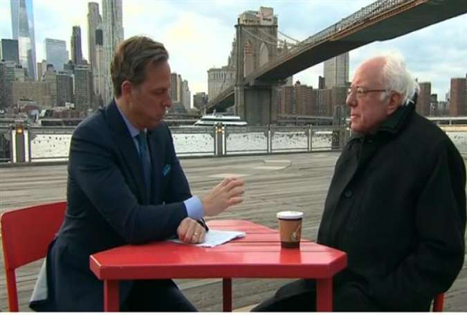 US Democratic presidential candidate Bernie Sanders (right) during an interview with CNN