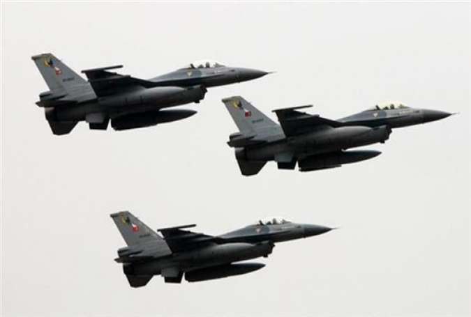 Turkish F-16 fighter jets fly in formation during a parade in Istanbul, Turkey.