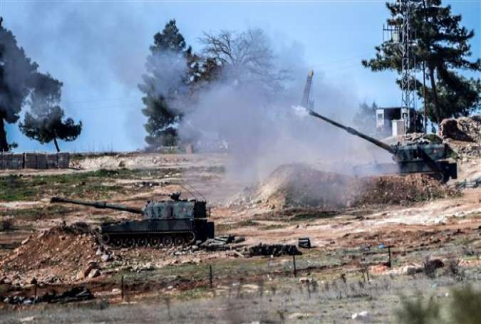 Turkish tanks fire from their army position close to the town of Kilis, south central Turkey, towards the Syria border, on February 17, 2016.