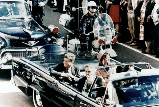 Former US President and Mrs. John F. Kennedy, and Texas Governor John Connally ride through Dallas moments before Kennedy was assassinated, November 22, 1963.