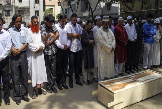 Relatives and friends attending the funeral prayer for a Bangladeshi victim of a hacking attack in the capital Dhaka.