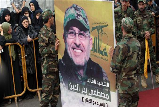 Members of the Lebanese resistance movement, Hezbollah, carry a portrait of Mustafa Badreddine, a top Hezbollah commander who was killed in an attack in Syria, during his funeral in the Ghobeiry neighborhood of southern Beirut on May 13, 2016.