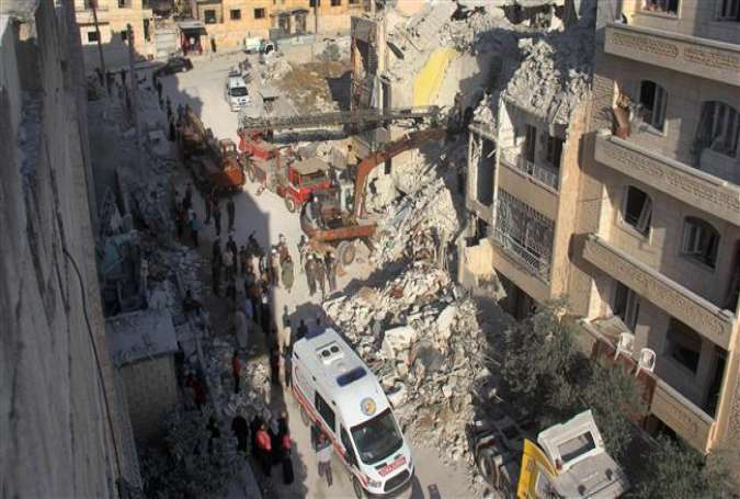 Syrian Civil Defense members search on May 31, 2016 for survivors amid the rubble following airstrikes in Syria’s northwestern province of Idlib.