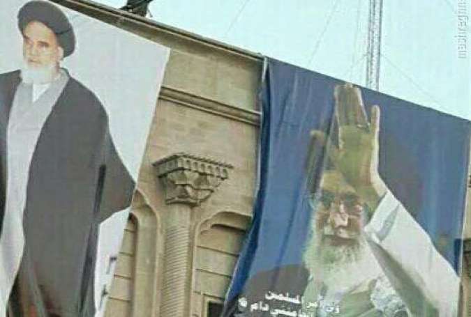 نصب عکس امام و رهبری بر بالکن کاخ صدام