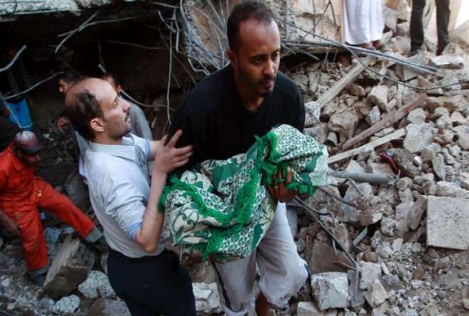 Rescuers carry the body of a baby girl, who was retrieved from the rubble of a home, after it was struck overnight by Saudi airstrikes in the capital Sana’a, Yemen, February 10, 2016.