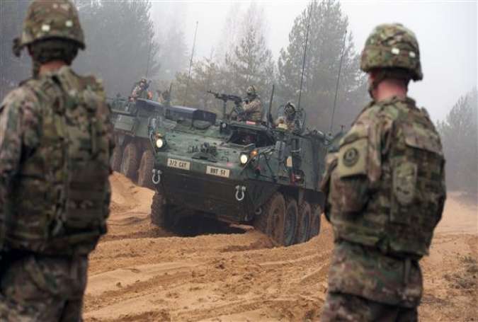 Armored fighting vehicles IAV Stryker of the US Cavalry Regiment 2nd subdivision during military training with Latvian and Canadian soldiers at the Adazi military training area in Latvia.