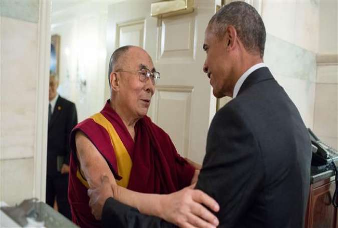 US President Barack Obama greets the Dalai Lama at the entrance of the Map Room of the White House, on June 15, 2016.