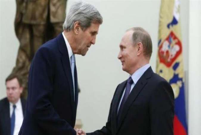 Russian President Vladimir Putin (R) welcomes US Secretary of State John Kerry during a meeting at the Kremlin in Moscow on December 15, 2015.