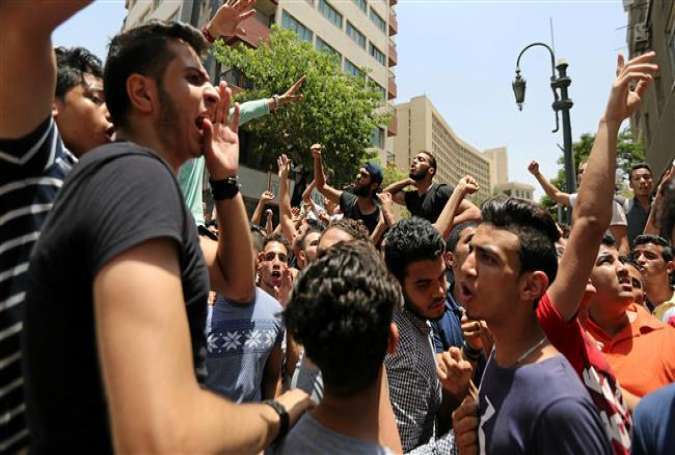 High school students take part in a protest against the cancellation and postponement of exams after a series of exam leaks in front of the parliament in Cairo, Egypt, on June 27, 2016.