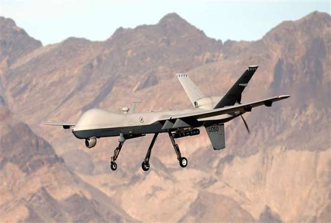 An MQ-9 Reaper remotely piloted aircraft flies by during a training mission November 17, 2015 at Creech Air Force Base in Indian Springs, Nevada.