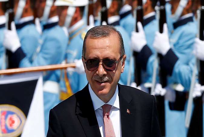 Turkish President Tayyip Erdogan reviews a guard of honour during a welcoming ceremony at the Presidential Palace in Ankara, Turkey