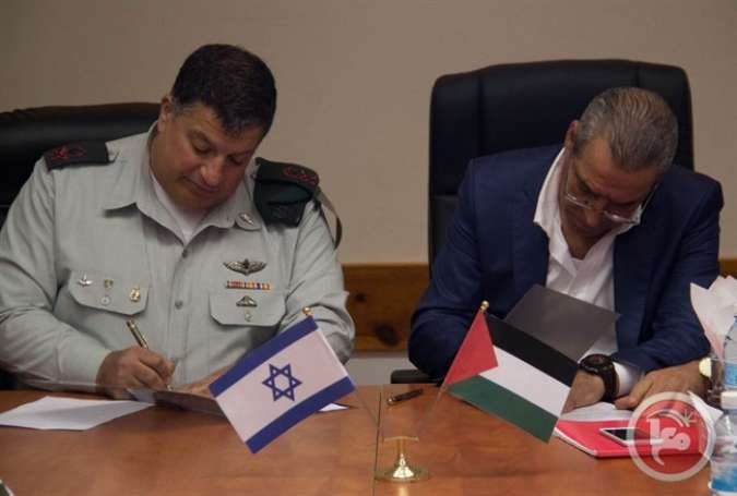 Yoav Mordechai and Hussein al-Sheikh sign memorandum of understanding.