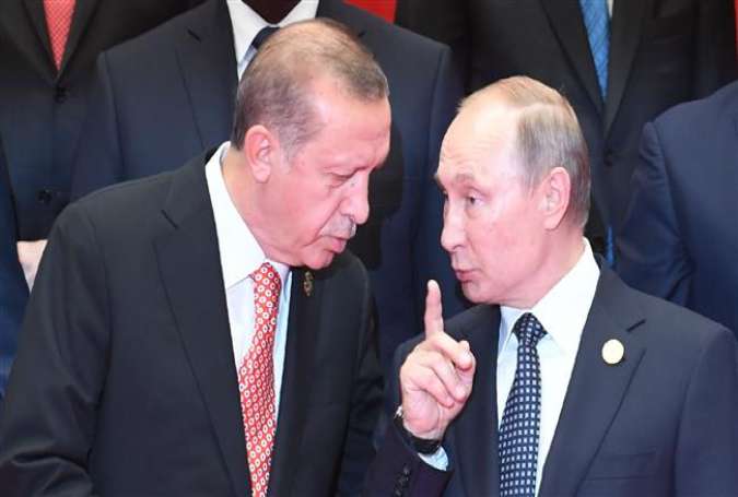 Turkey’s President Recep Tayyip Erdogan (L) listens to Russia’s President Vladimir Putin (C) in a photo taken on the sidelines of the G20 summit in Hangzhou, China, on September 4, 2016.