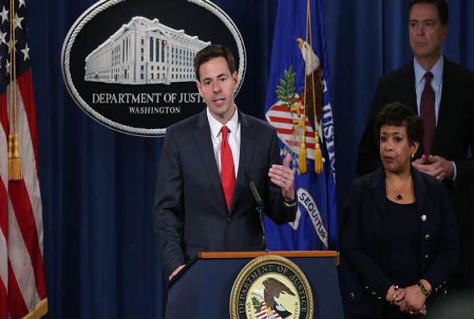US Assistant Attorney General for National Security John Carlin (L) speaks as Attorney General Loretta Lynch (2nd L), and FBI Director James Comey (R) listen during a news conference on March 24, 2016 in Washington, DC.