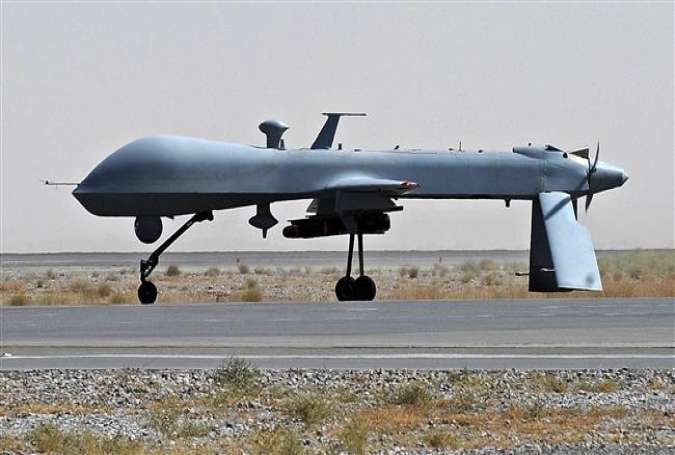 This is a file photo of a US Predator unmanned drone armed with a missile waiting on the tarmac of the Kandahar military airport in Afghanistan.
