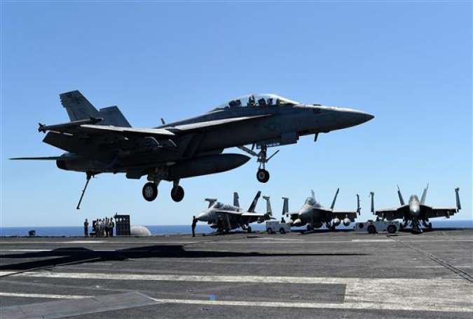 A F/A-18F Super Hornet lands on the US Navy