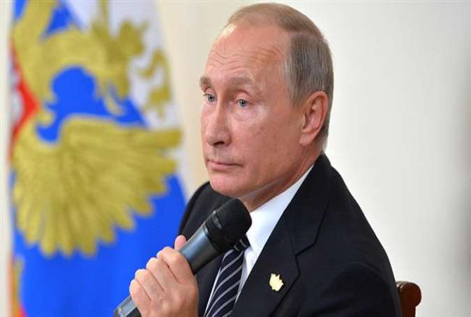 Russian President Vladimir Putin is seen during a news conference following the summit meeting of the BRICS group of emerging economies in Goa, India, October 16, 2016.