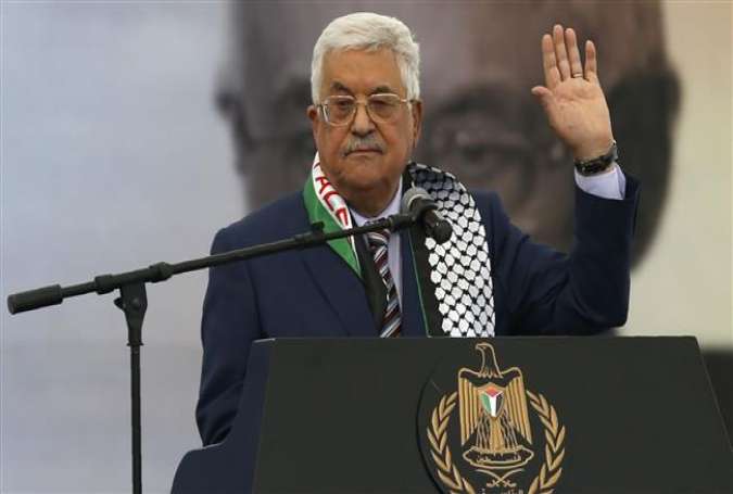 Palestinian president Mahmoud Abbas gestures as he gives a speech during a rally marking the 12th anniversary of the death of late Palestinian leader Yasser Arafat in the West Bank city of Ramallah on November 10, 2016.