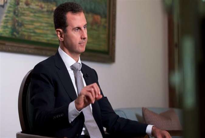 A file photo of Syrian President Bashar al-Assad speaking during an interview