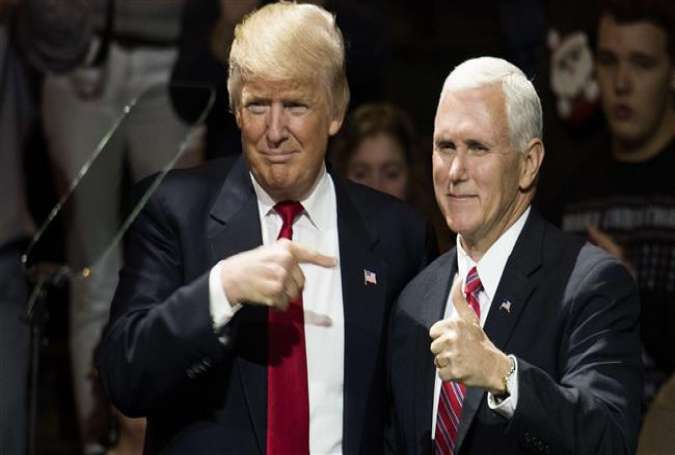 US President-elect Donald Trump and Vice President-elect Mike Pence stand onstage together at US Bank Arena on December 1, 2016 in Cincinnati, Ohio.