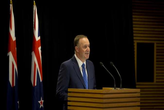 In this handout photo, New Zealand’s Prime Minister John Key is seen announcing his resignation in Wellington, December 5, 2016.