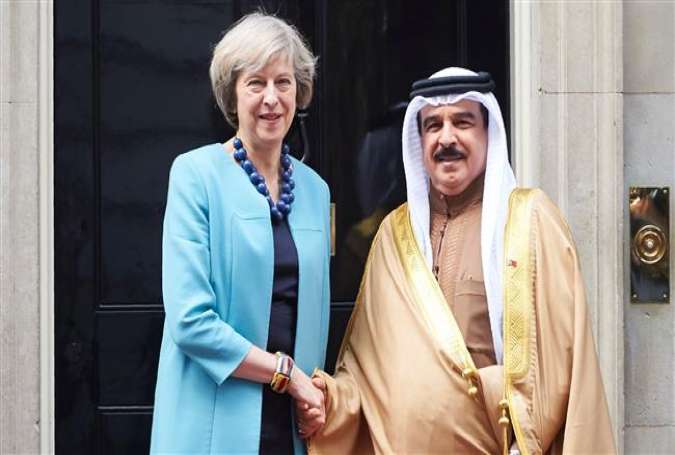 British Prime Minister Theresa May (L) greets Bahrain
