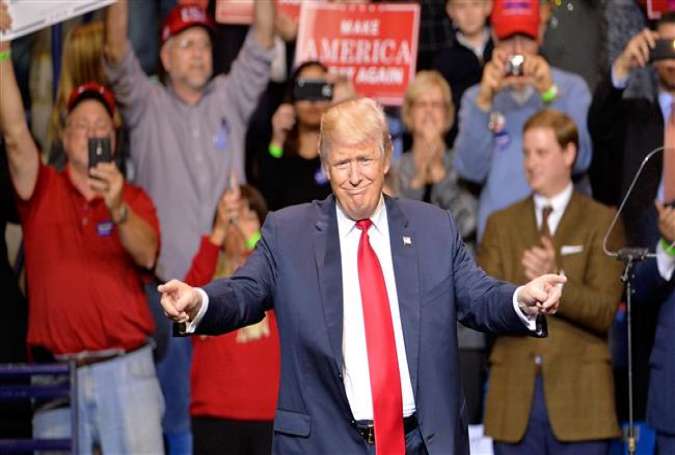 US President-elect Donald Trump points to his supporters during his "Thank You" rally at Crown Coliseum on December 6, 2016 in Fayetteville, North Carolina.