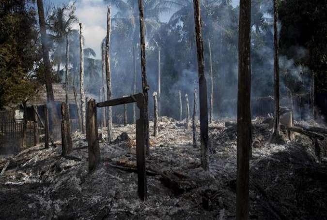 In this file photograph taken on October 14, 2016, debris of burned houses is seen in Warpait village, Rakhine State, Myanmar.